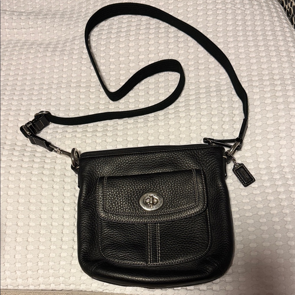 Coach Black Leather Crossbody Bag with adjustable strap.